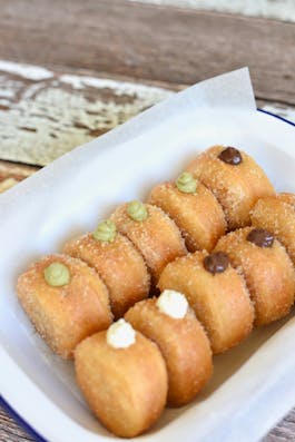 Malasadas with Pistachio Chocolate pudding and Vanilla Cream